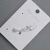 Gold-tone stud earring with kaf on the earlobe, 11x28 mm ± white crystals